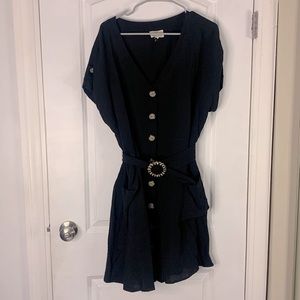Black midi dress with bottom front and belt. Linen like material